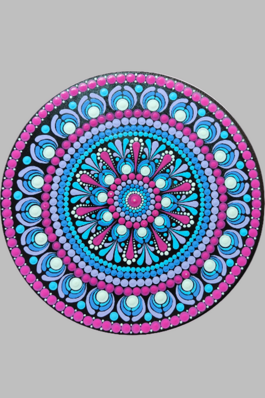 Decorative circular wall art with a mandala design on a wall